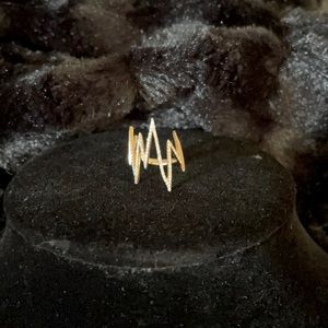 14 gold and diamond pinkie ring.